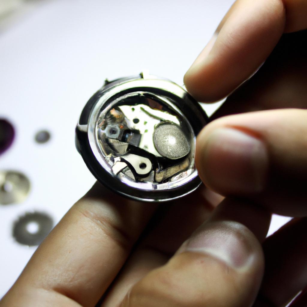 Person examining watch movement parts